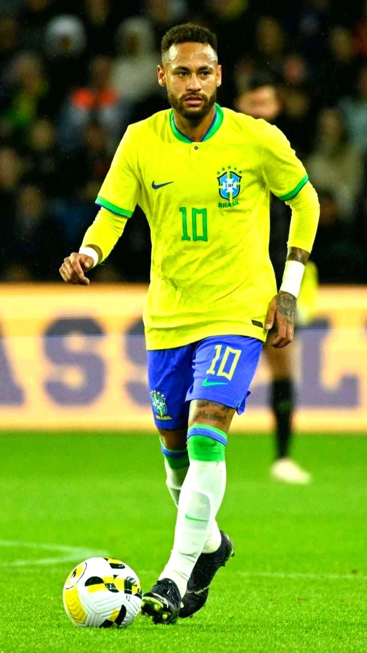 A Brazil soccer player in a yellow jersey and blue shorts, wearing number 10, controls a soccer ball on the field during a match, as the action is broadcast live via Croatia IPTV.